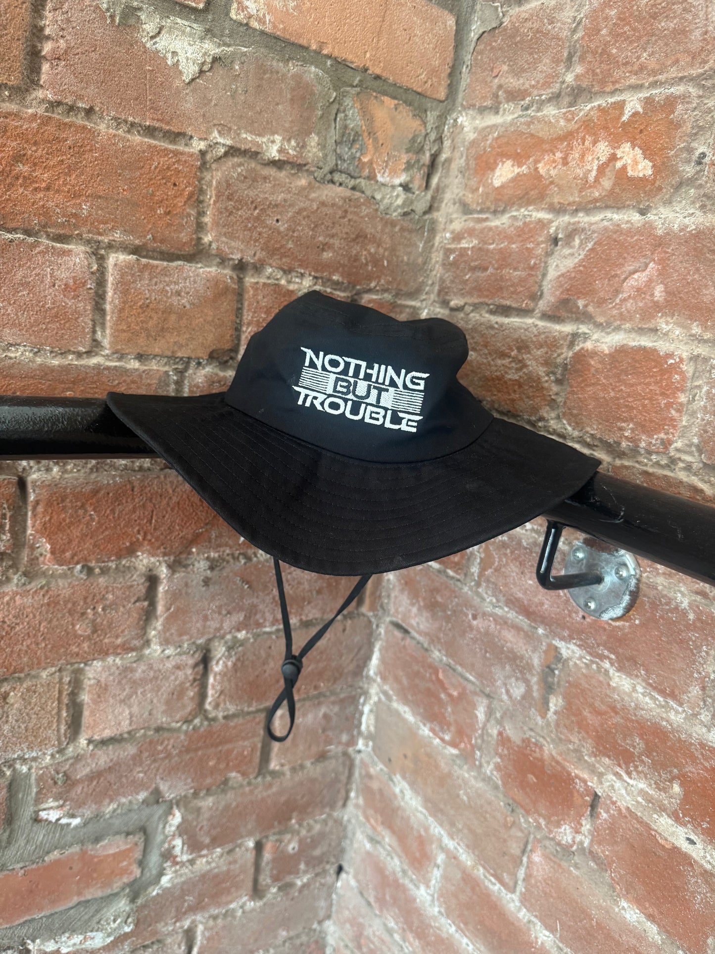 NOTHING BUT TROUBLE BUCKET HAT