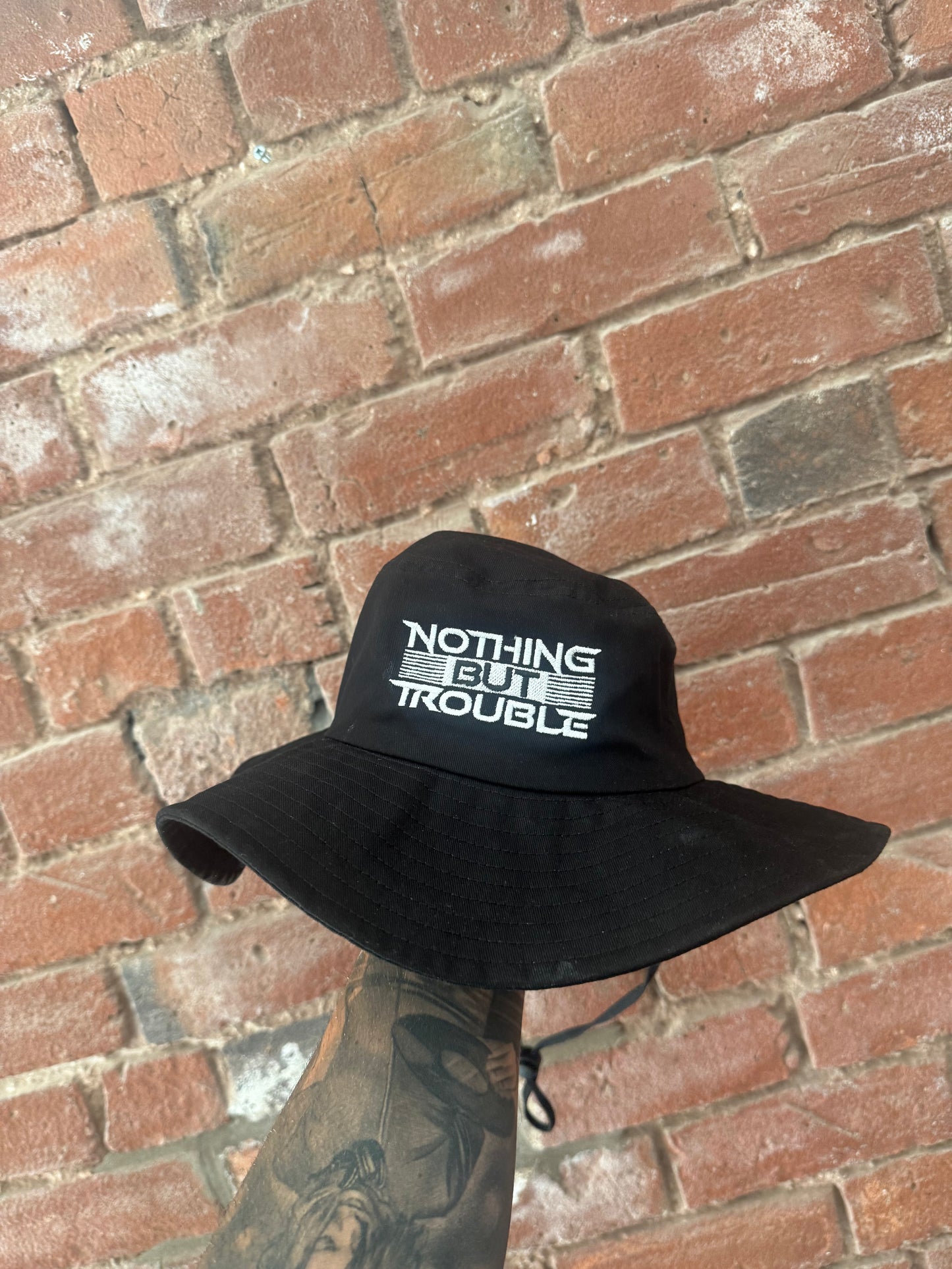NOTHING BUT TROUBLE BUCKET HAT