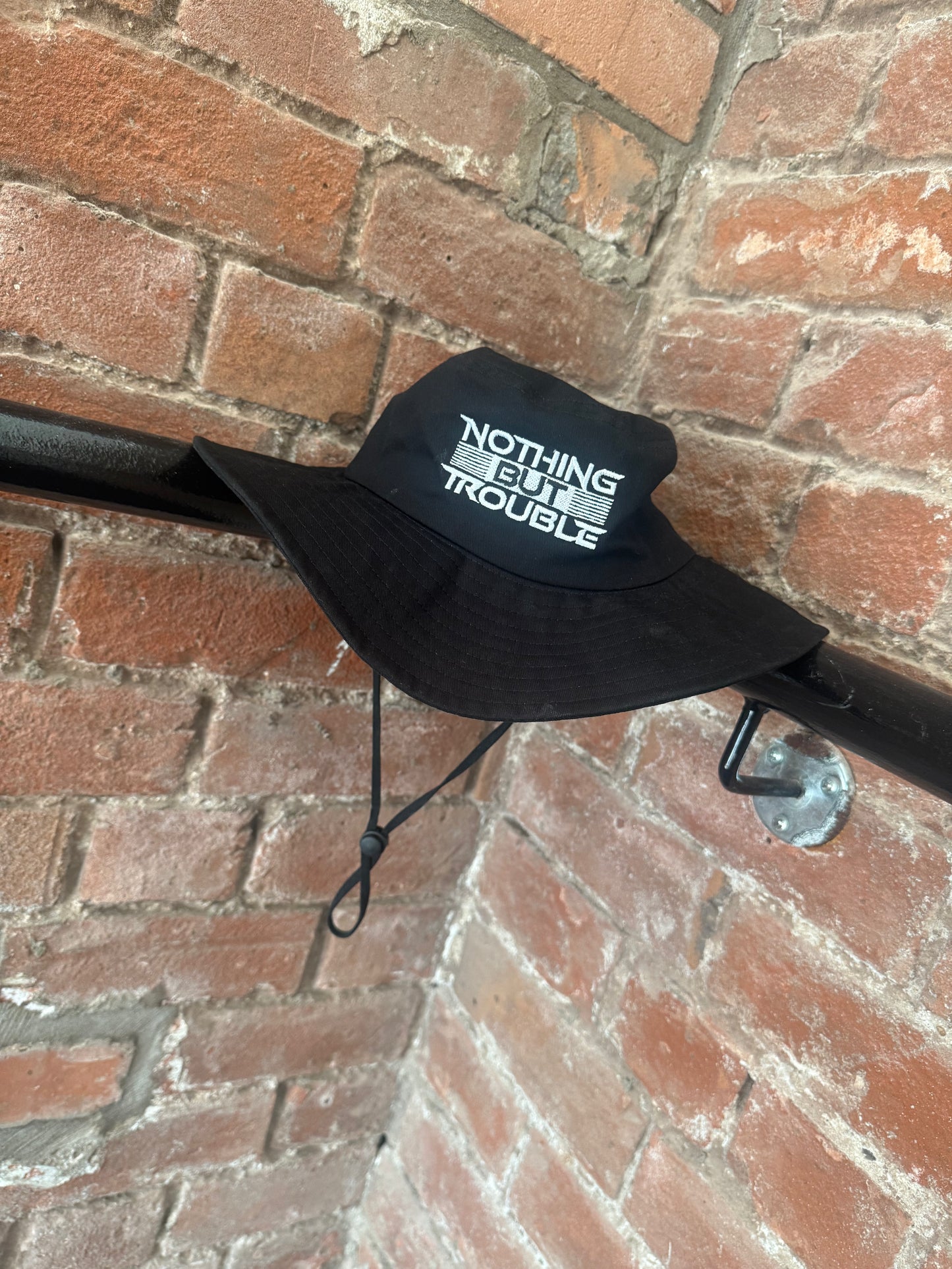 NOTHING BUT TROUBLE BUCKET HAT